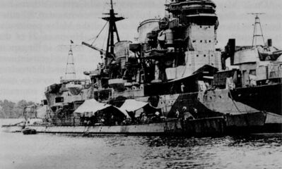 Singapore Naval Base - Japanese Occupation  U-Boats
1945. German U-boats U-181 and U-862 alongside IJN battleship 'Myoko'. The U-boats were trying to trade mercury for raw materials for Germanys high spec steel manufacture but were trapped in Singapore after the fall of Germany. The Japanese commandeered the subs and renamed them I-501 and I-502 respectively. Photo compliments of Dieter Hille Chief Engineering Officer of U-181 who was 'requested' to train the Japanese to operate his boat. Dieter and the crews were kept in huts just outside Changi Prison. 
