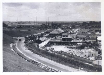 Singapore Naval Base - Japanese Occupation. Dockyard Main Gate
Dockyard Main Gate 1945. As found after Japanese occupation. Note abandoned Japanese trucks. Photo curtesy of Mr Earland Clear Chief Civil Engineer Singapore Dockyard 1945 - 1946.  
Keywords: Japanese;Occupation;Main gate