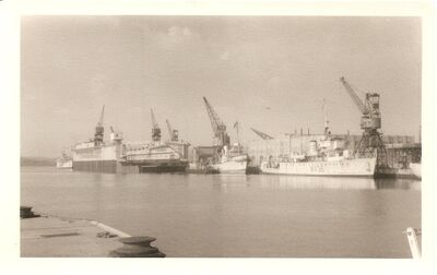 Singapore Dockyard - 1951
1951. General view of the Dockyard. Showing Admiralty Floating Dock 31 and M436 HMS Magicienne. 
