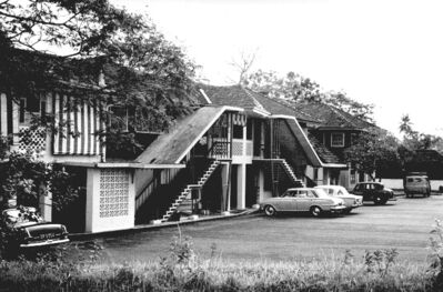 Singapore Naval Base - The Dockyard Club 1964
The Dockyard Club located on Lagos Circle. I understand the building was built by the Japanese during occupation. It was central for many of the social activities undertaken by the Civilian workmen and their families posted to Singapore Dockyard. As well as bar, small restaurant, stage and dance floor etc it had snooker tables and photographic darkroom.  
Keywords: Naval; Navy; Photography; 