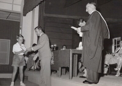 Royal Naval Base School prize giving1958
RN School prize giving at the Naval Base 'Japanese Theatre'. Peter Banks receives an award from Mr Harry Fulthorpe. (Chief Constructor at the Royal Naval Dockyard)
Keywords: Navy;Naval;Student;Pupil;Sembawang;Dockyard;Civilian;Japanese